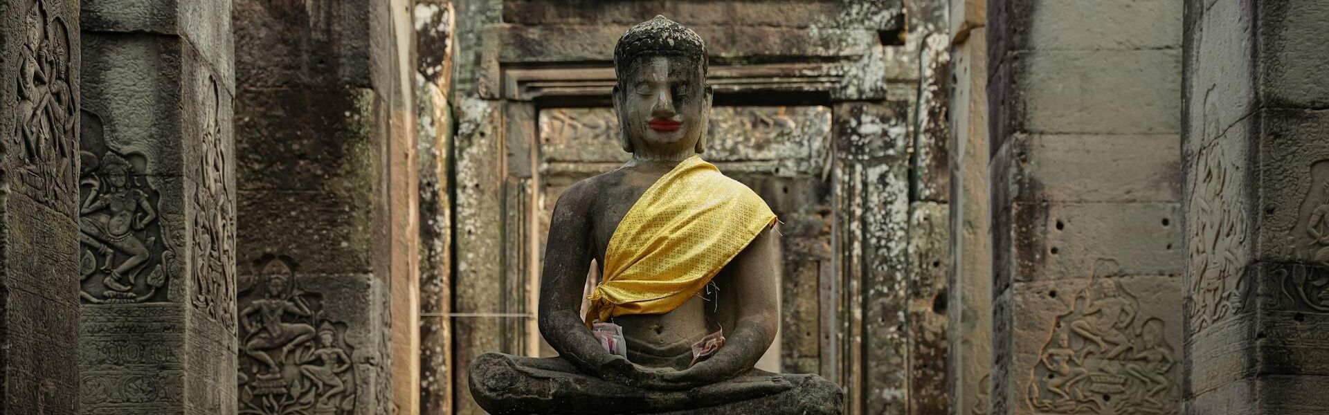 Siem Reap’s lush temple grounds in Cambodia on a Siem Reap Travel banner by Legend Travel Group.